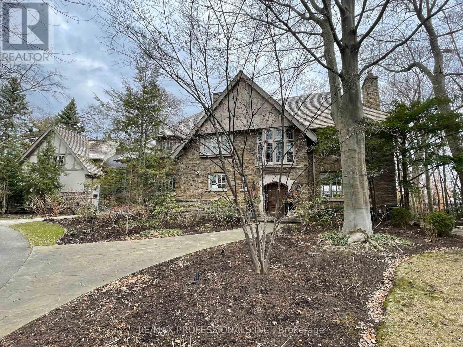 Quintessential Kingsway!  This is the first estate to be built in the Kingsway, located on the best and first lots in the Kingsway, selected for the most overall table land available on the Humber River ravine - 43 The Kingsway is the crown jewel of the neighbourhood. If you've ever driven through the neighbourhood, you already know this home - it's the one with the glass atrium with copper roof, the one that glows at night & is full of light during the day. Since construction, the home has been meticulously stewarded by its owners and tastefully updated to blend modern sensibilities without losing the Kingsway feeling. From the outside, you'll appreciate Jim Mosher's dramatic Humber River stone landscaping, and the elegant, particularly Kingsway, styling of the rear extension is seamless. Enter the show-stopping glass atrium, complete with heated floors and a wrought iron spiral staircase. To your left is an oversized three-car garage with ample storage. Up the spiral staircase, the guest or nanny suite is built to impress - vaulted ceilings, floor-to-ceiling Humber River ravine views. The main house is built for entertaining. The reimagined flow of the first floor features multiple formal living spaces, an airy family room, an elegant extended-family-sized dining room, & new chef's kitchen - overbuilt with the consummate entertainer in mind, with truly flawless marble work. The 2nd floor is built around the primary suite, featuring a sitting room with views of the River, an impressive walk-in closet, dual primary baths, & fireplace. The floor has three more bedrooms, all with abundant closet space & remarkable views. The 3rd floor is adaptable - with large dormers overlooking the ravine, ample closet space & a four-piece bathroom, this could be a secondary primary bedroom, a rec room with office, a playroom, or the alternate nanny suite.The lower level features rec room & gym, walkout to the rear lawns. (id:48254)