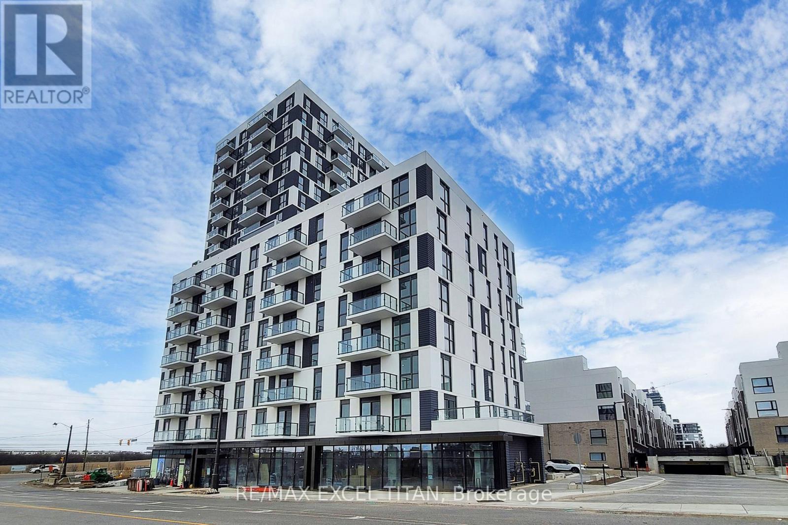 303 - 335 Wheat Boom Drive, Oakville, Ontario  L6H 7C2 - Photo 1 - W12699430