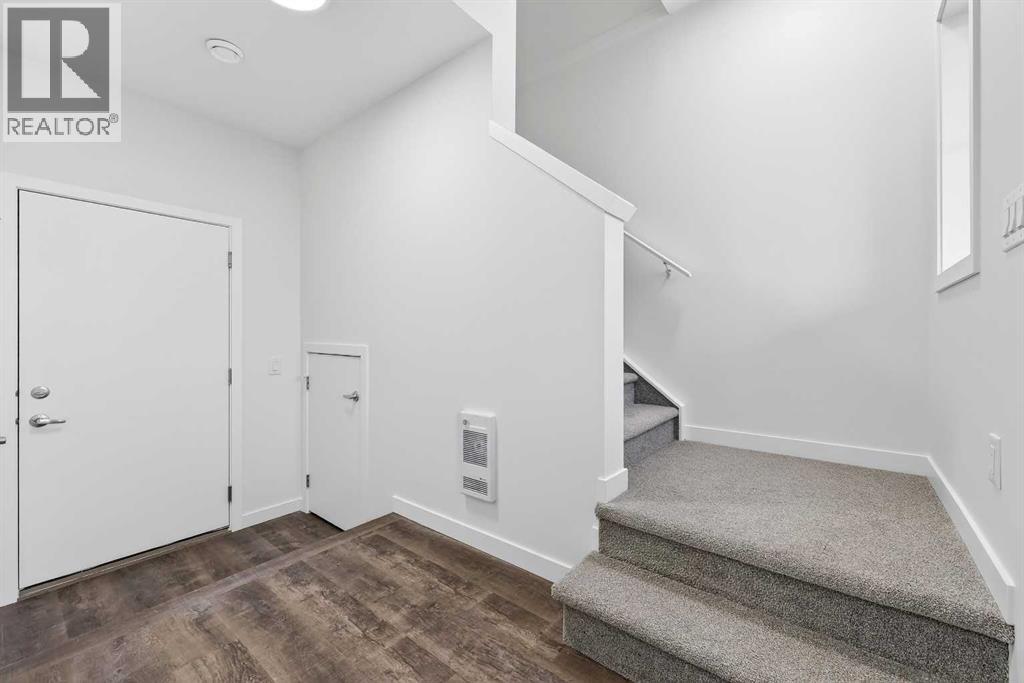 92 Creekside Drive Sw, Calgary, Alberta  T2X 6E2 - Photo 7 - A2279434