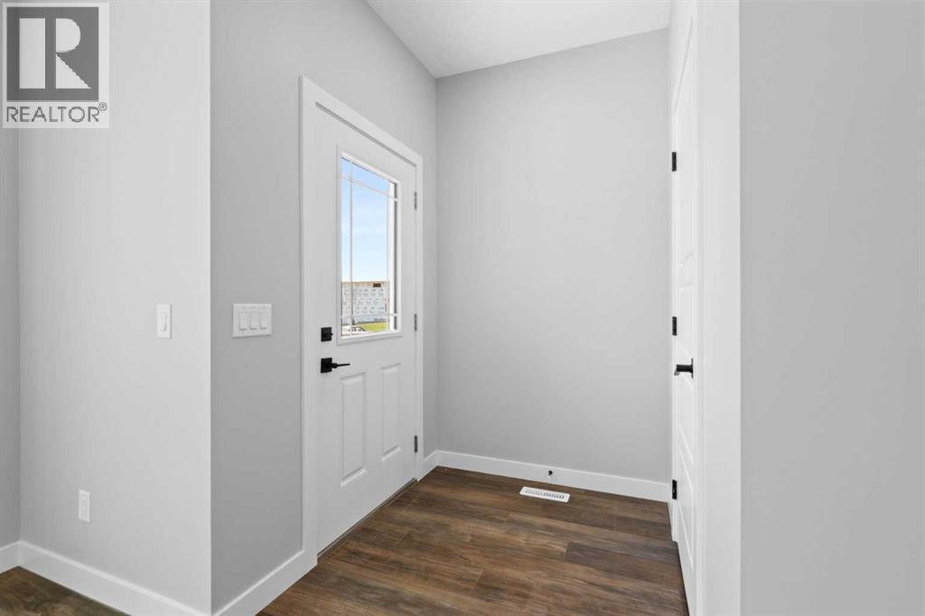 65 Amblefield Heights Nw, Calgary, Alberta  T3P 2K1 - Photo 5 - A2269561