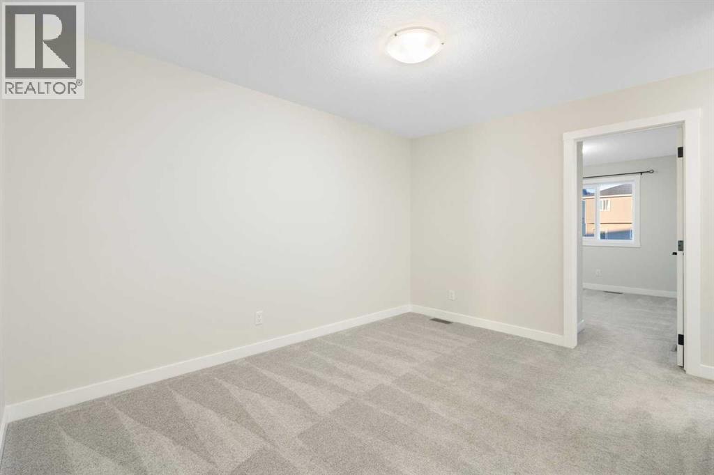 99 Edith Passage Nw, Calgary, Alberta  T3R 2B5 - Photo 26 - A2278688