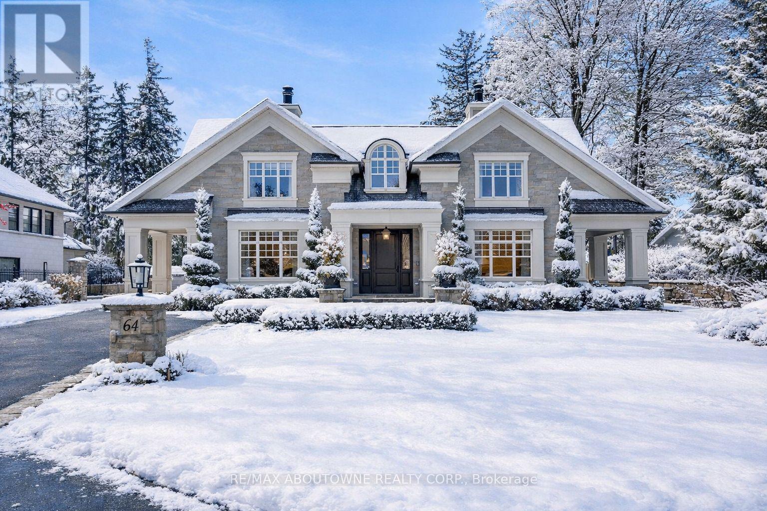 Welcome to 64 Brentwood Road, where a exquisitely crafted home masterfully blends timeless design and modern features. Located on one of the most coveted and prestigious streets and steps to the shoreline of Lake Ontario, this exceptional home is situated on an expansive 100 x162 lot and offers over 10,000 sq ft of luxurious living space. Designed by award winning architect Michael Pettes and built by renowned builders PCM, this elegant home offers the finest finishes throughout. The property is beautifully landscaped, providing a private and resort like outdoor oasis complete with a saltwater pool with cascading waterfall, perfect for summer relaxation as well as outdoor gourmet kitchen and wood burning fireplace for effortless entertaining as well as a outdoor bathroom for privacy for guests. Inside, indulge in a impeccably crafted and light filled living space with heated floors, designer light fixtures and finishes. The heart of the home is the gourmet kitchen with Wolf and Subzero appliances, with an additional servery and a spacious pantry. Upstairs the home boasts 4 generous bedrooms, each with their own ensuite for privacy and comfort for family and guests. The primary bedroom offers a relaxing retreat with spa like bathroom and large walk in closet with balcony and views of the manicured rear yard. A fully finished walk up basement offers a large recreation and games space with built-in bar, climate controlled wine cellar, home theatre, gym as well as a 5th bedroom/ nanny suite with ensuite bathroom. With a lavish stone exterior, a 3 car garage with additional lift, elevator and safe room, this charming home seamlessly combines elegance with luxury offering the best of both worlds. Whether enjoying the expansive interior, relaxing by the pool, or strolling to the lake, this home provides an unparalleled lifestyle in one of Oakville's most sought-after neighbourhoods. (id:48254)