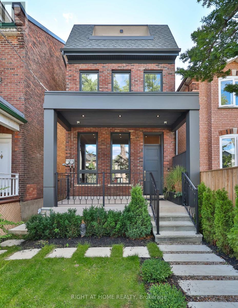 In the heart of the city, yet set within a quiet, tree-lined neighbourhood, this fully renovated 4,200 square foot residence offers the best of both worlds. A rare two-storey laneway home at the rear adds exceptional flexibility and long-term value.Every inch has been reimagined with modern finishes and timeless design, creating a home that feels both sophisticated and welcoming. High ceilings and light-filled spaces are enhanced by east and west exposures, delivering natural sunlight throughout the day.The interiors showcase refined craftsmanship throughout, from the custom-designed kitchen with premium appliances and millwork to versatile living spaces ideal for both everyday life and entertaining. The top floor is dedicated to a private primary retreat with a spa-inspired ensuite, heated floors, a library or lounge area, and two private balconies. All bathrooms throughout the home feature heated floors.The lower level offers high ceilings, heated floors, a bright living area, kitchenette, full bathroom, and an additional bedroom, ideal for guests or extended family.At the rear, the two-storey laneway home features its own entrance, secure garage, and a bright one-bedroom plus den, two-bathroom suite with kitchen. Ideal for multi-generational living, a private workspace, guest accommodations, or short-term rental income, the laneway suite offers a rare opportunity to significantly offset monthly carrying costs.Steps to acclaimed restaurants, neighbourhood parks, cafés, grocery stores, and transit, this exceptional property brings together luxury, location, and lifestyle in perfect harmony. (id:48254)