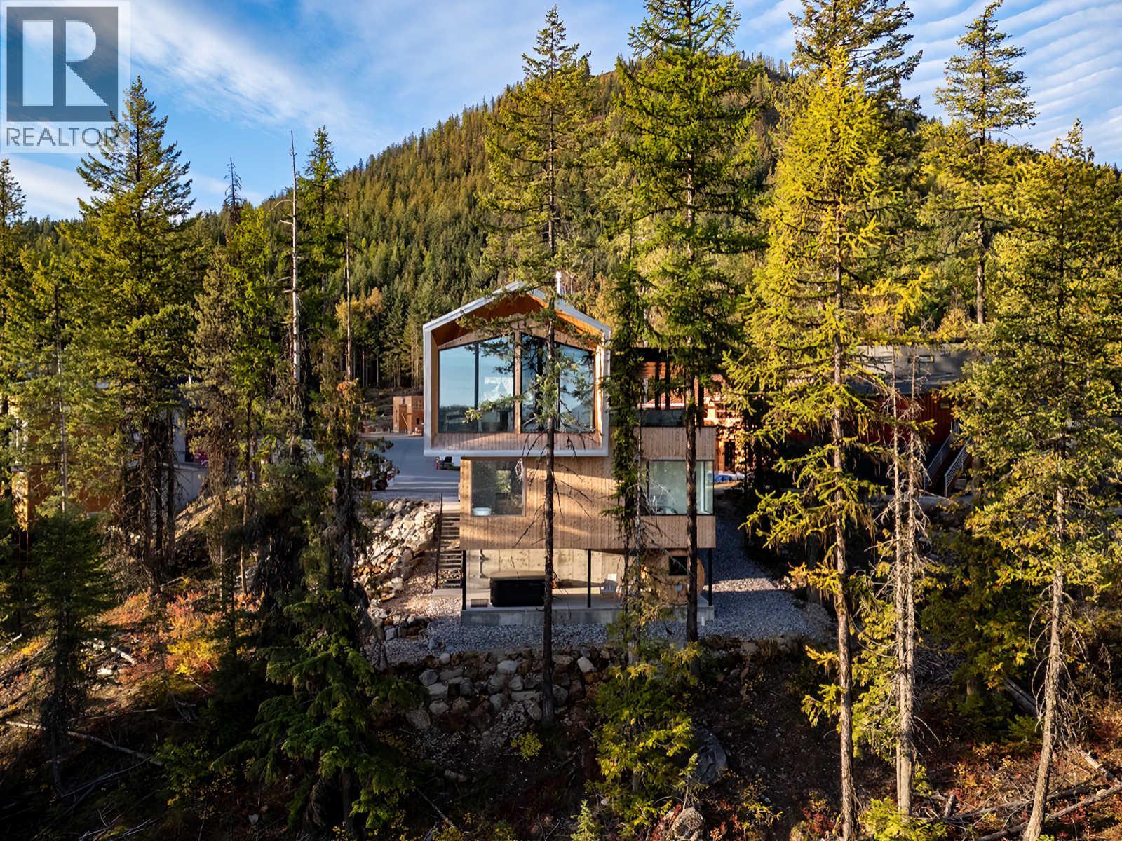 <div class="slider-price">$2,550,000</div><p>322 Larch Terrace, Rossland, British Columbia</p>