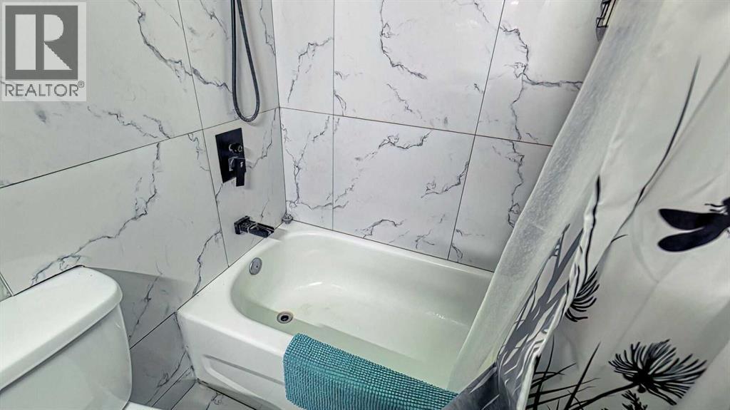 152 Oaktree Lane Sw, Calgary, Alberta  T2V 4E4 - Photo 14 - A2279714