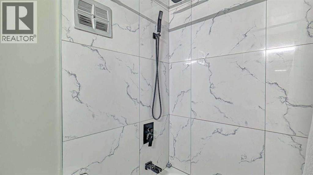 152 Oaktree Lane Sw, Calgary, Alberta  T2V 4E4 - Photo 15 - A2279714