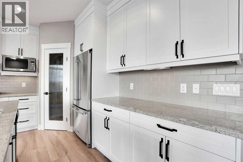 179 Panatella Cape Nw, Calgary, Alberta  T3K 0W3 - Photo 6 - A2279943