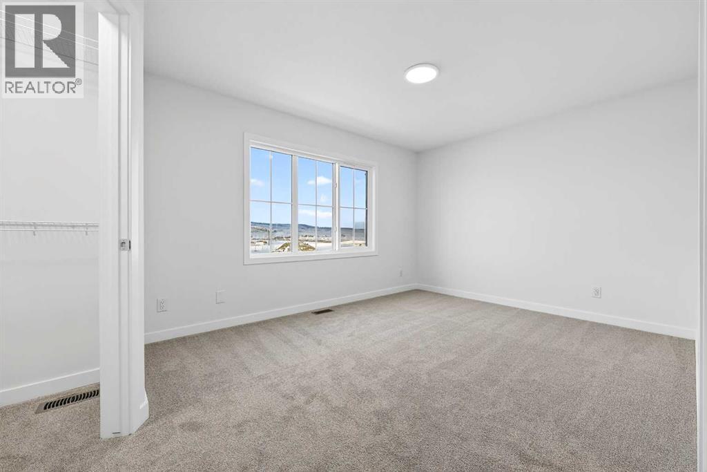 92 Creekside Drive Sw, Calgary, Alberta  T2X 6E2 - Photo 4 - A2279434