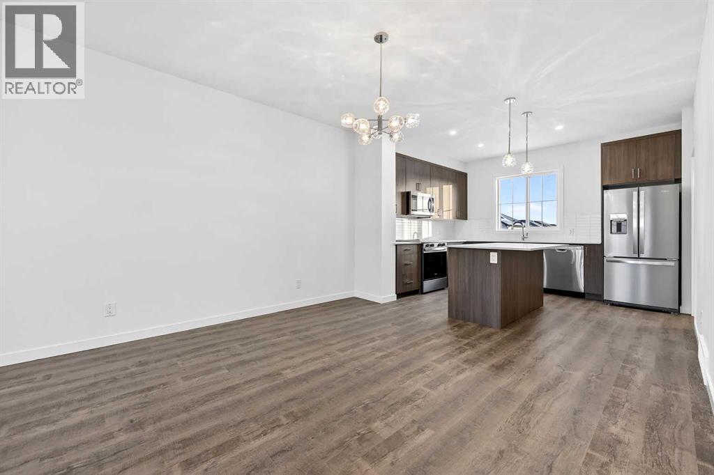 92 Creekside Drive Sw, Calgary, Alberta  T2X 6E2 - Photo 3 - A2279434