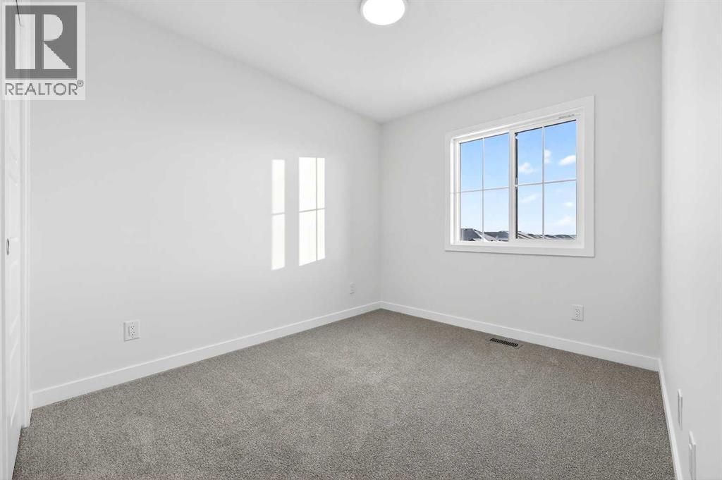 92 Creekside Drive Sw, Calgary, Alberta  T2X 6E2 - Photo 5 - A2279434