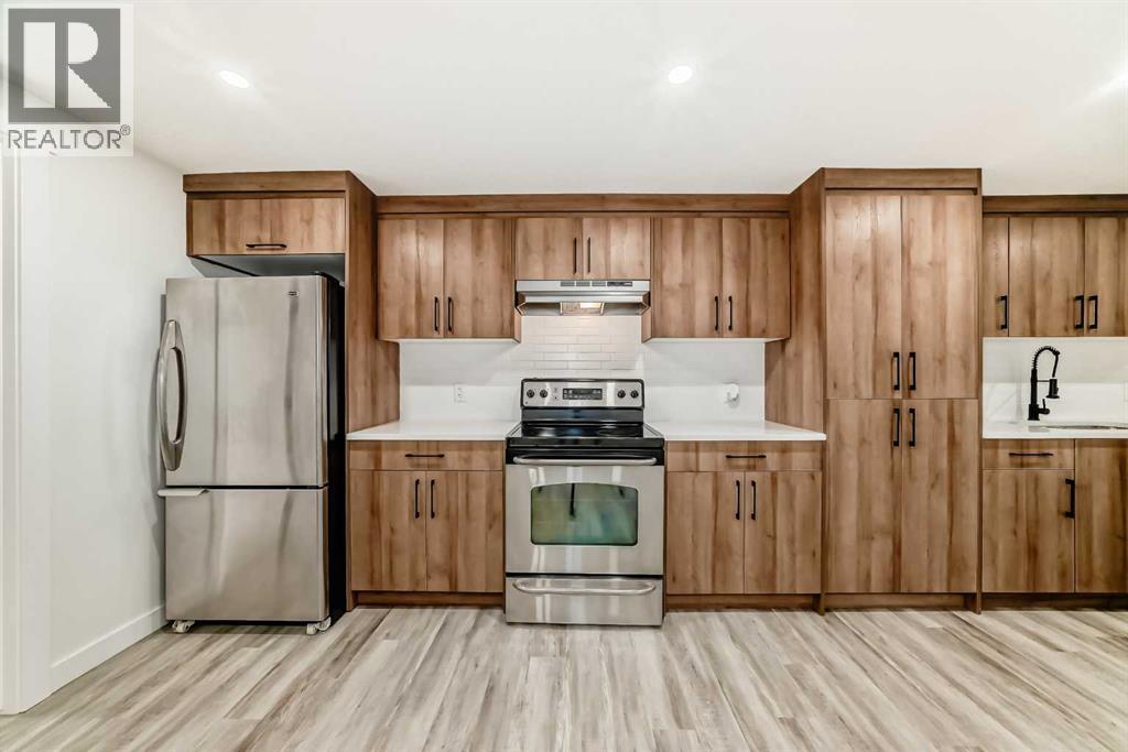 946 Berkley Drive Nw, Calgary, Alberta  T3K 1A2 - Photo 31 - A2264876