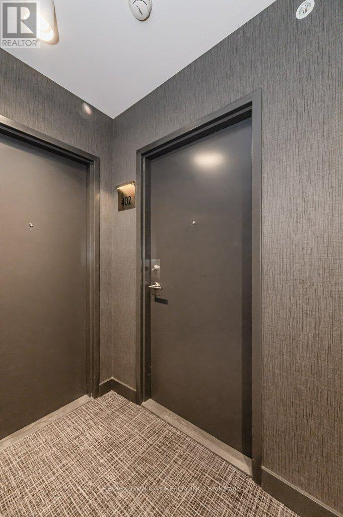 402 - 85 Duke Street, Kitchener, Ontario  N2G 1A6 - Photo 2 - X12708454