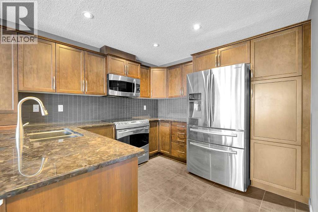 157 Windstone Avenue Sw, Airdrie, Alberta  T4B 3R3 - Photo 5 - A2276923