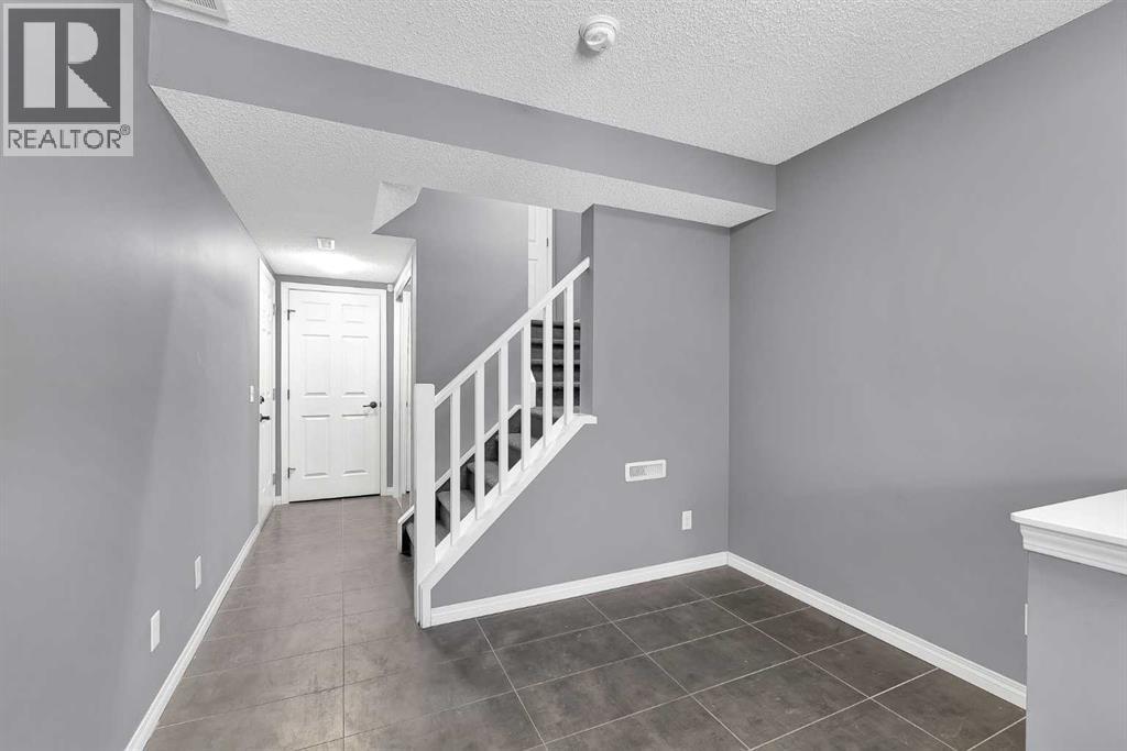 157 Windstone Avenue Sw, Airdrie, Alberta  T4B 3R3 - Photo 3 - A2276923