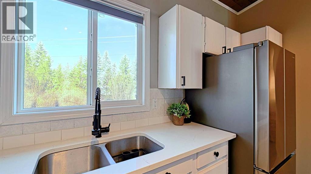 152 Oaktree Lane Sw, Calgary, Alberta  T2V 4E4 - Photo 11 - A2279714