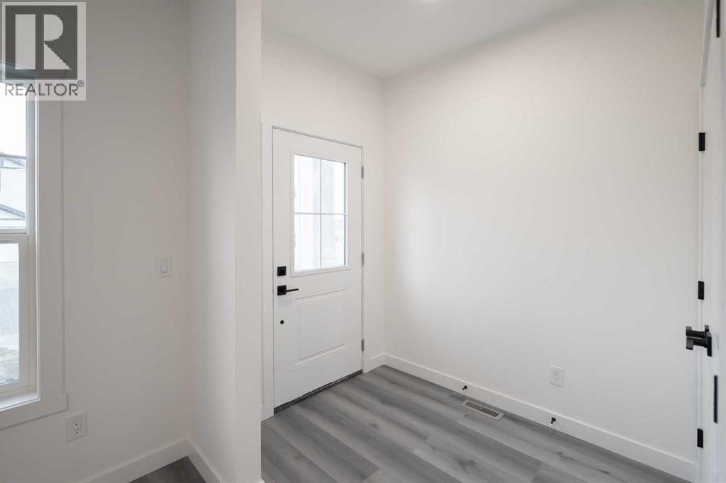 55 Baysprings Terrace Sw, Airdrie, Alberta  T4B 4A7 - Photo 4 - A2266129