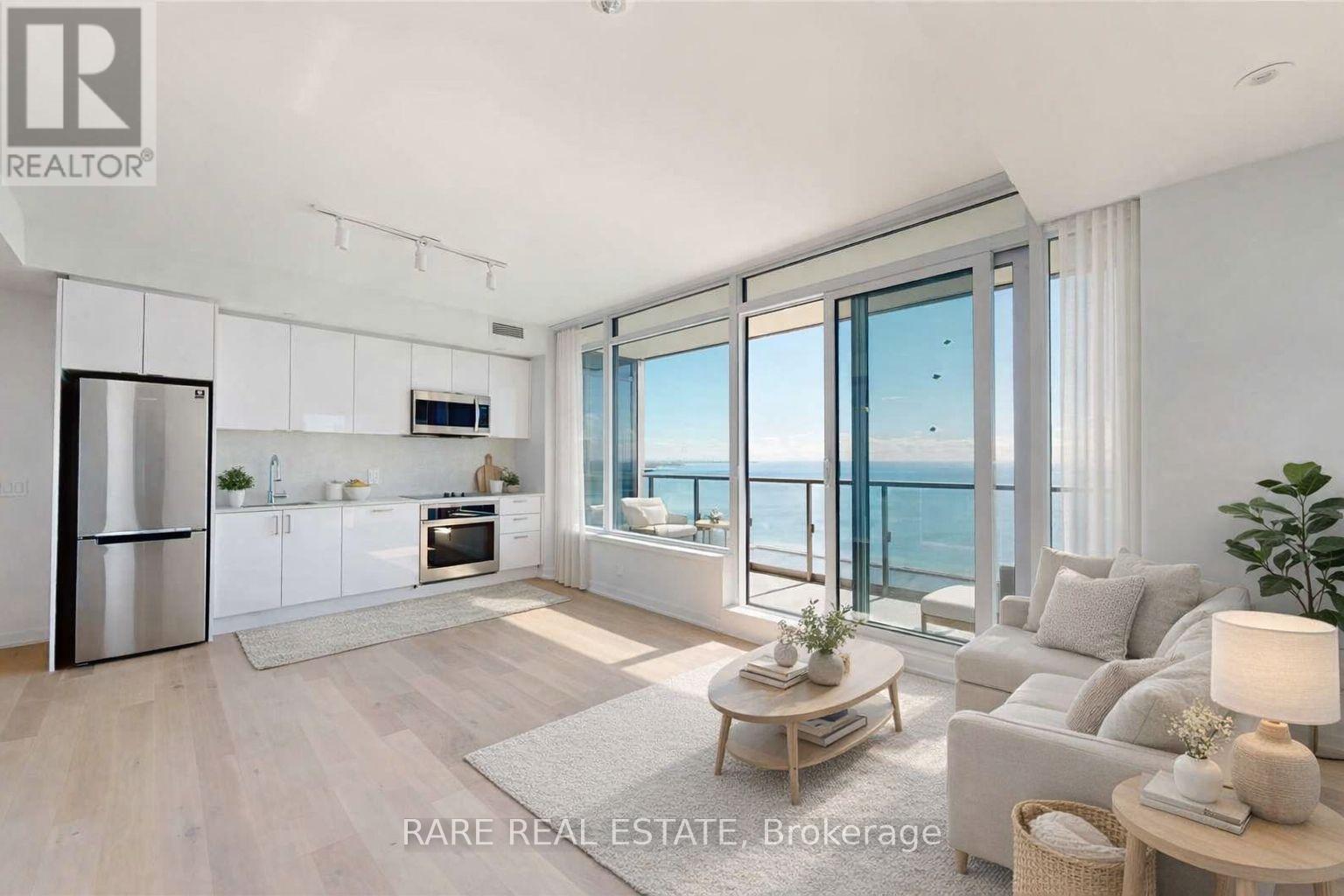 Perched high above the waterfront at Mirabella Luxury Condos, this 3-bedroom, 2-bathroom residence feels equal parts polished and effortless. Sunlight pours through every room, highlighting a bright open-concept layout and elevated finishes throughout. The best part? Panoramic, south-facing views of Lake Ontario, a constant, calming backdrop from morning coffee to golden hour. Enjoy resort-style amenities and a lifestyle that's as convenient as it is beautiful, with quick access to Hwy 427, the Gardiner, QEW, and transit, plus trails, parks, and Toronto's vibrant waterfront just steps from your door. Parking and locker included. (id:48254)