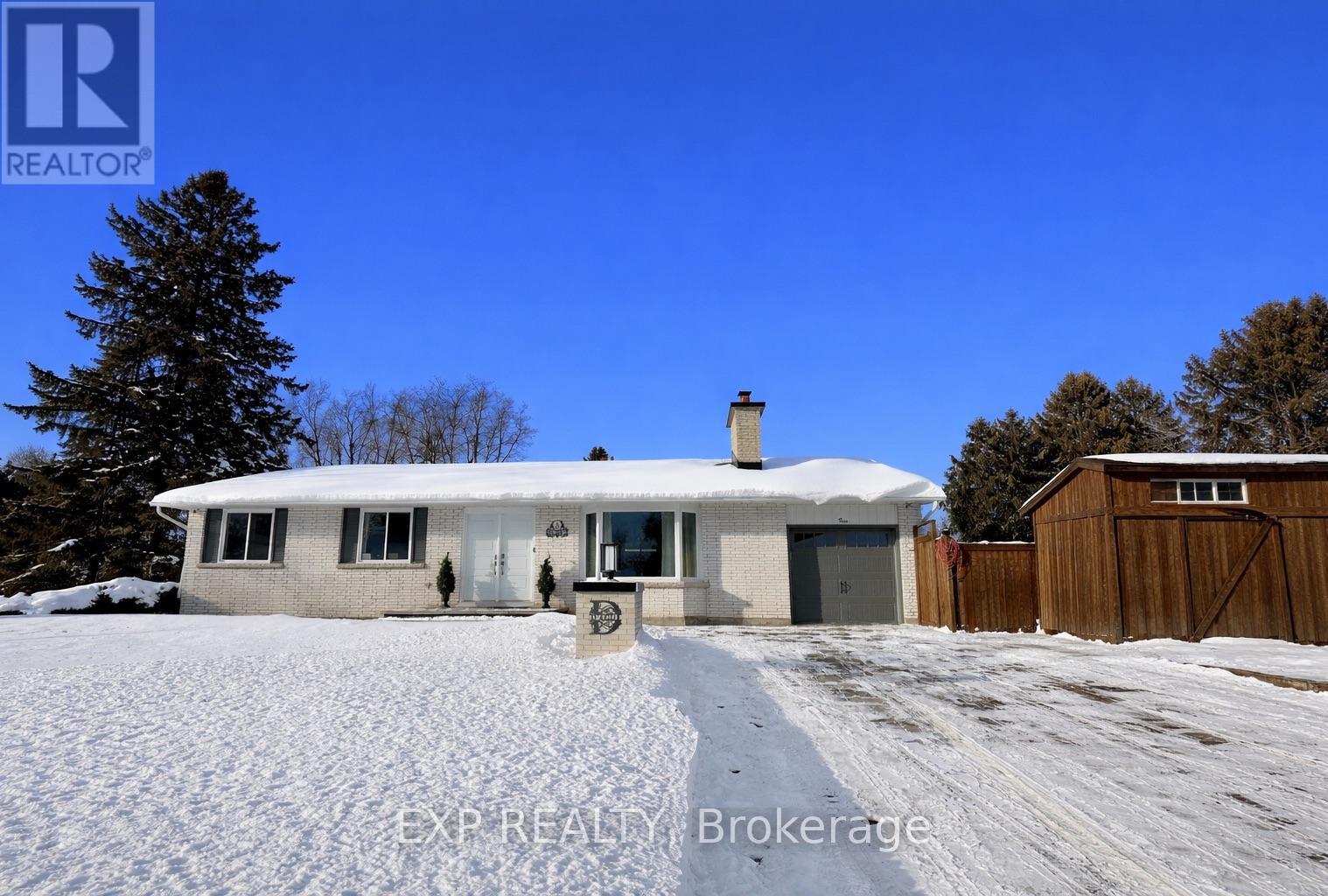 This beautifully renovated 3-bedroom, 2-bath bungalow has seen roughly $250,000 in updates, combining luxury, style, and functionality. The living room showcases a natural almond trail stone wood-burning fireplace and waterproof, scratch-resistant vinyl floors. Smart voice-controlled lighting upstairs and downstairs can change colors, creating the perfect ambiance. The Thomasville kitchen (2024) features soft-close drawers and cabinets, Dekton countertops, a 10x4 ft island, matte black fixtures, a large black sink, European tile backsplash, and premium LG appliances with a chefs hood fan. Off the kitchen, a 4 season sunroom with heated floors, wood-burning masonry fireplace, built-in heater, and 2x2 ft European tiles provides year-round comfort. The upstairs bath includes a modern walk-in shower, maple vanity with quartz countertop, Rubi faucets, and an LED mirror, while bedrooms offer LED ceiling fans and a his-and-hers walk-in closet. The basement is fully finished with a built-in bar, brick wall wood-burning fireplace, gym or storage room, and a spa-like bathroom (2020) with new plumbing, Tenzo faucets, quartz vanity, walk-in shower, Large Freestanding Neptune bathtub, European tile, and LED mirror. Major systems include a gas furnace (2020), new ductwork, A/C (2020), and owned hot water tank (2024). Outdoors, the private fenced yard is a retreat with natural stone walkways, seating area, pergola, Canadian luxury spa Jacuzzi with speakers and lights, and a pull-down projector screen perfect for movie nights. Architectural pot lights illuminate the brick exterior, holiday lighting adds charm, and the front interlock (2024) leads to parking for four cars plus garage. Triple-pane windows and new sliding doors provide excellent insulation. Nothing is rented, everything is owned. Located in a family-friendly Nepean neighbourhood close to parks, schools, shopping, and downtown Ottawa, this home blends high-end finishes and thoughtful upgrades, ready for move-in. (id:48254)