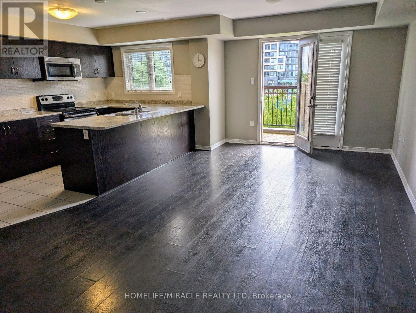 69 - 2441 Greenwich Drive, Oakville, Ontario  L6M 0S4 - Photo 1 - W12715612