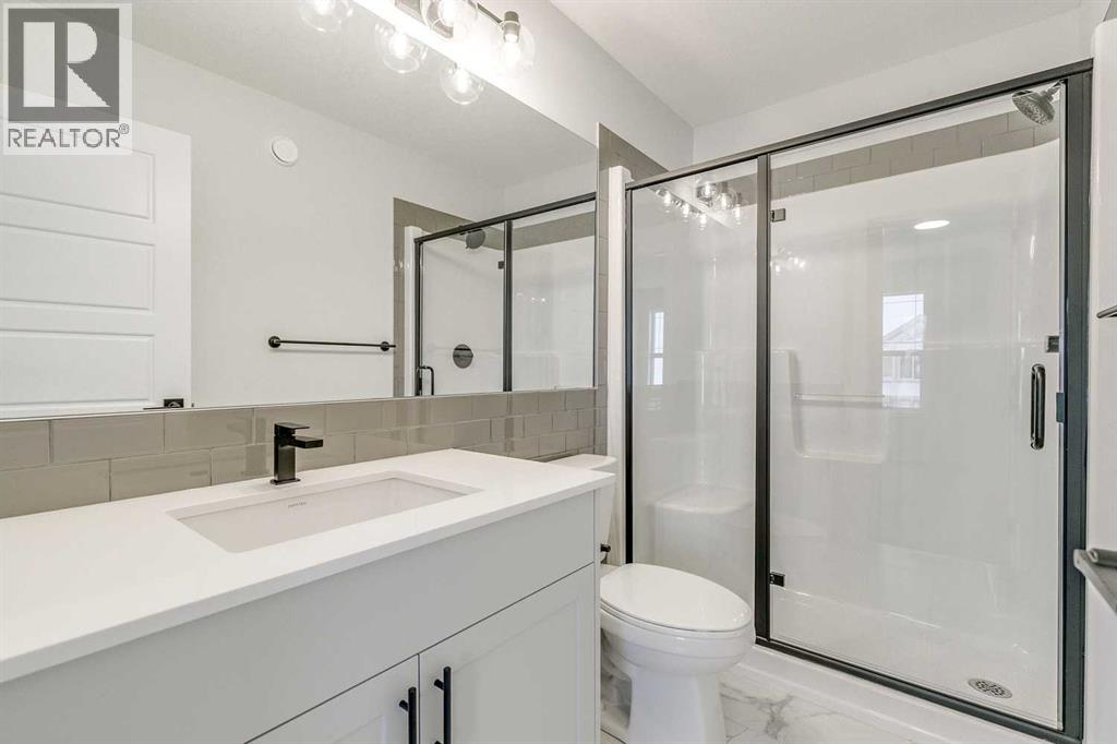 186 Creekside Manor Sw, Calgary, Alberta  T2X 6J5 - Photo 25 - A2272147