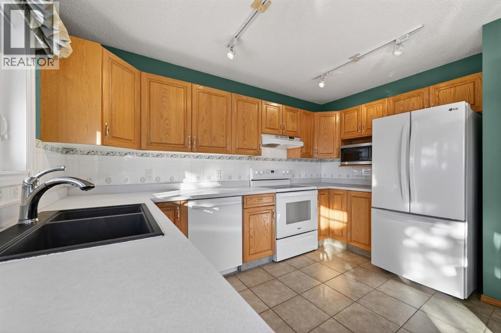 206 Arbour Cliff Close Nw, Calgary, Alberta  T3G 3W7 - Photo 9 - A2278123