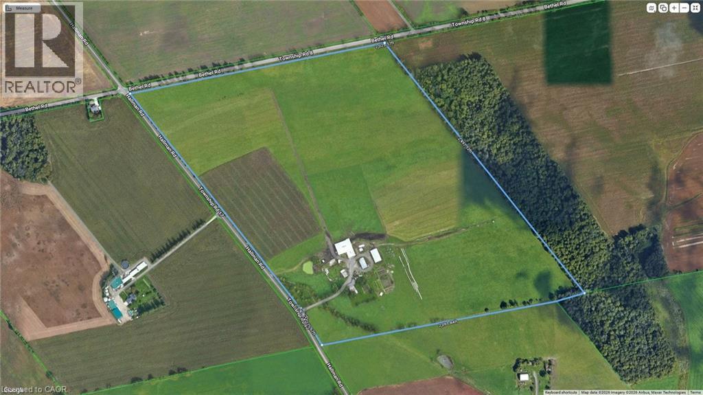 This exceptional 100-acre organic farm offers 90 workable acres with productive Perth Loam and Tavistock Loam, sandy loam and clay loam soils, ideal for crop and livestock operations. The property features a spacious 5-bedroom, 2-bath home with an attached 2-car garage, beautifully surrounded by mature silver maple and black walnut trees for privacy and shade. Farm infrastructure includes a barn built in 1989, originally designed for dairy and now set up for beef cattle with slatted flooring under the pens, an insulated and metal lined workshop with 13-foot ceilings and a concrete floor, an attached implement shed for tractor and equipment storage, an open-front pole structure for ample hay storage, and a small two-story barn/shed ideal for housing chickens or small livestock, making this a well-equipped and versatile agricultural property. (id:48254)