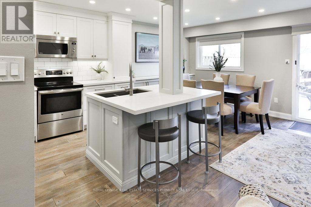 66 - 1558 Lancaster Drive, Oakville, Ontario  L6H 2Z4 - Photo 5 - W12721532