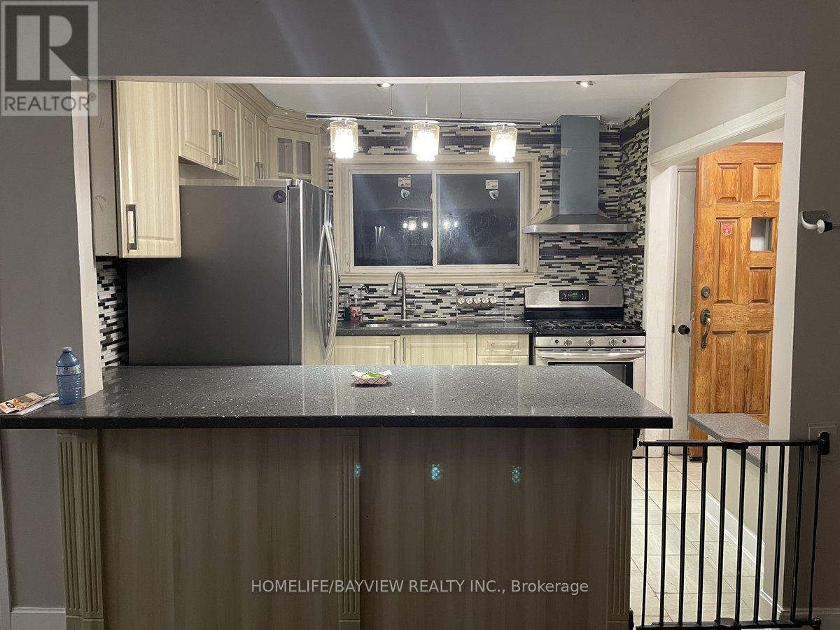 67 Neames Crescent, Toronto, Ontario  M3L 1K8 - Photo 4 - W12721756