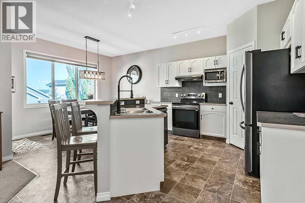 394 Cimarron Boulevard, Okotoks, Alberta T1S 0A9 - Photo 3 - A2263407