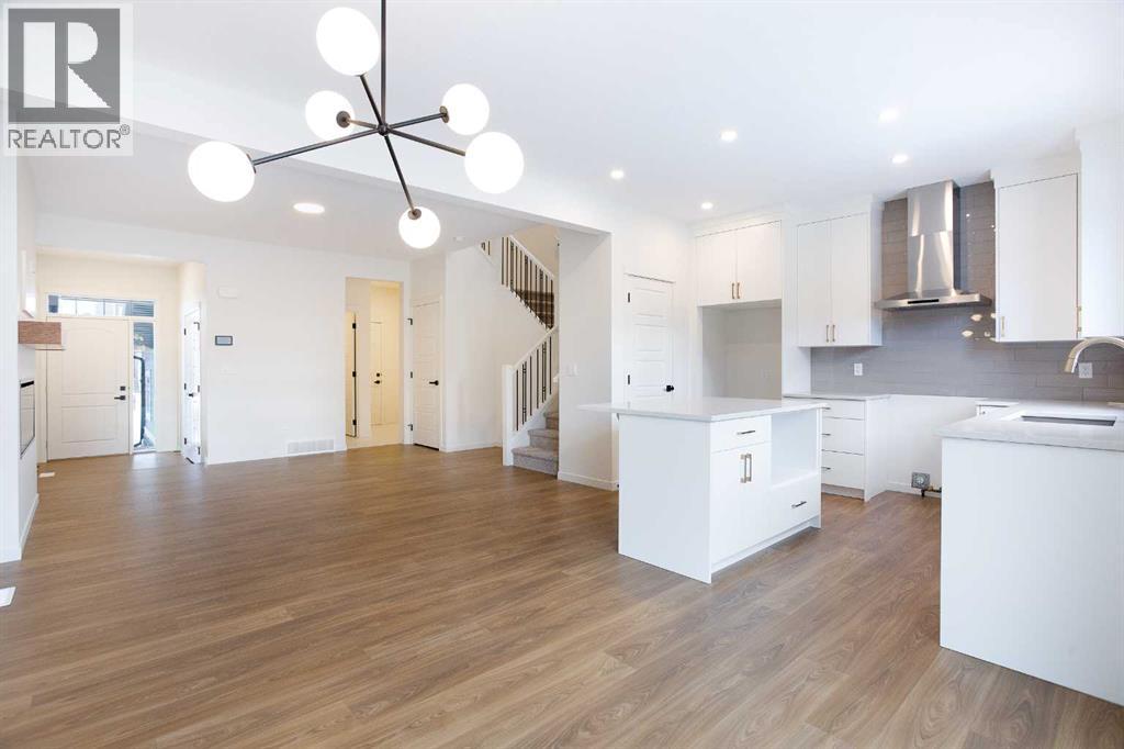 65 Creekside Passage Sw, Calgary, Alberta  T2X 5V6 - Photo 3 - A2279253