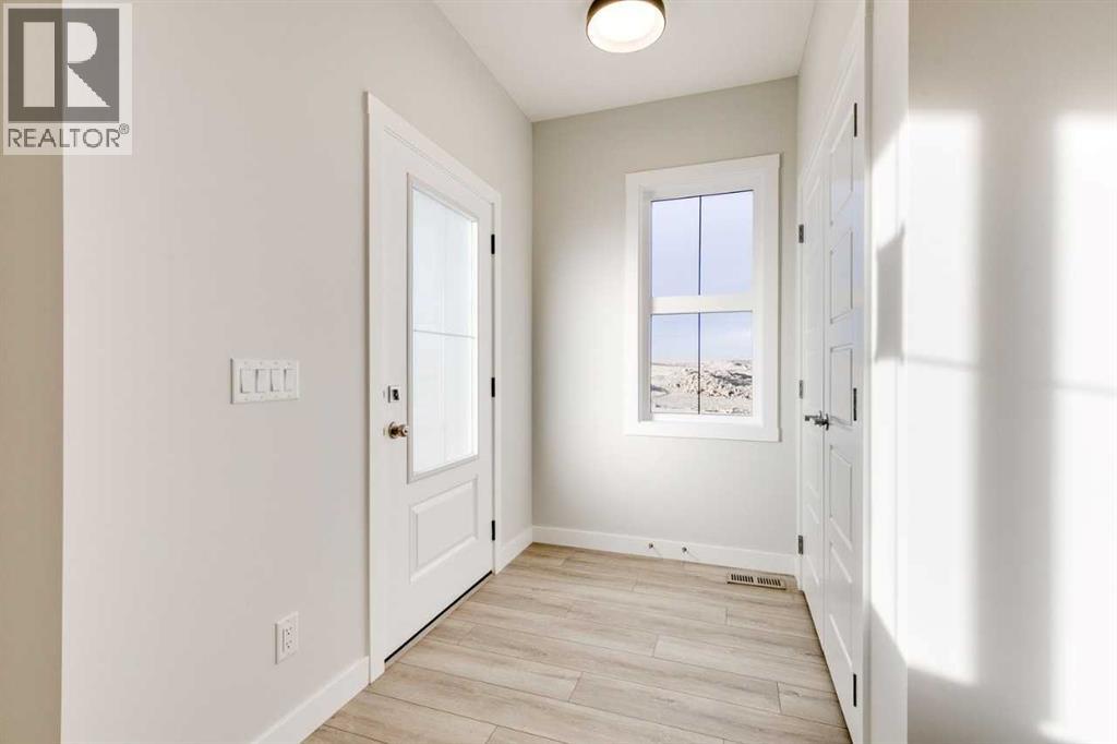 6 Drystone Way Nw, Calgary, Alberta  T3R 1E7 - Photo 3 - A2278264