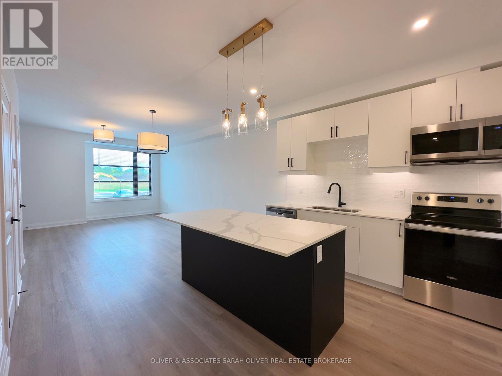 Welcome to this modern 2-bedroom, 3 bath condo in Lambeth, Ontario, offering style, space, and exceptional convenience. Designed with an open-concept layout, the unit features contemporary finishes throughout and a large kitchen island that anchors the bright living area-perfect for everyday living and entertaining. Both bedrooms offer comfort, with the main bedroom having a dedicated ensuite bathroom,  and privacy, while the private patio extends your living space outdoors. Ideally located close to shopping, schools, public transit, and quick highway access, this property is also near major employment hubs, including the Amazon delivery facility and to be built battery manufacturing plant, making it an excellent investment opportunity with strong rental appeal. Whether you're looking to live in or add to your portfolio, this condo delivers modern living in a rapidly growing area. Photos were done prior to the tenant moving into the condo. (id:48254)