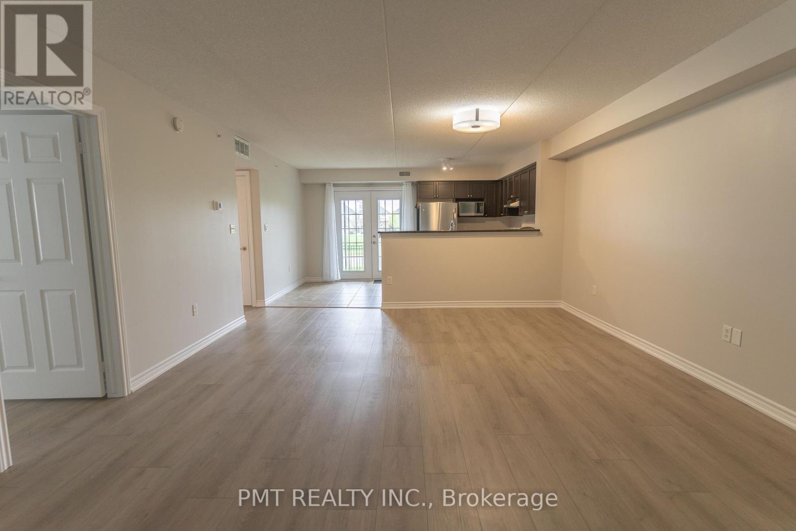 101 - 1370 Main Street E, Milton, Ontario  L9T 7S8 - Photo 2 - W12724656