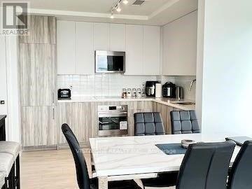 403 - 297 Oak Walk Drive, Oakville, Ontario  L6H 3R6 - Photo 3 - W12725126