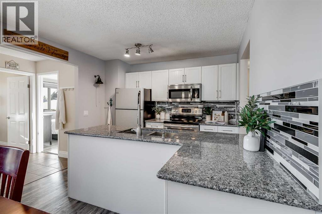 1205 Meadowbrook Drive Se, Airdrie, Alberta  T2A 1W6 - Photo 8 - A2281437