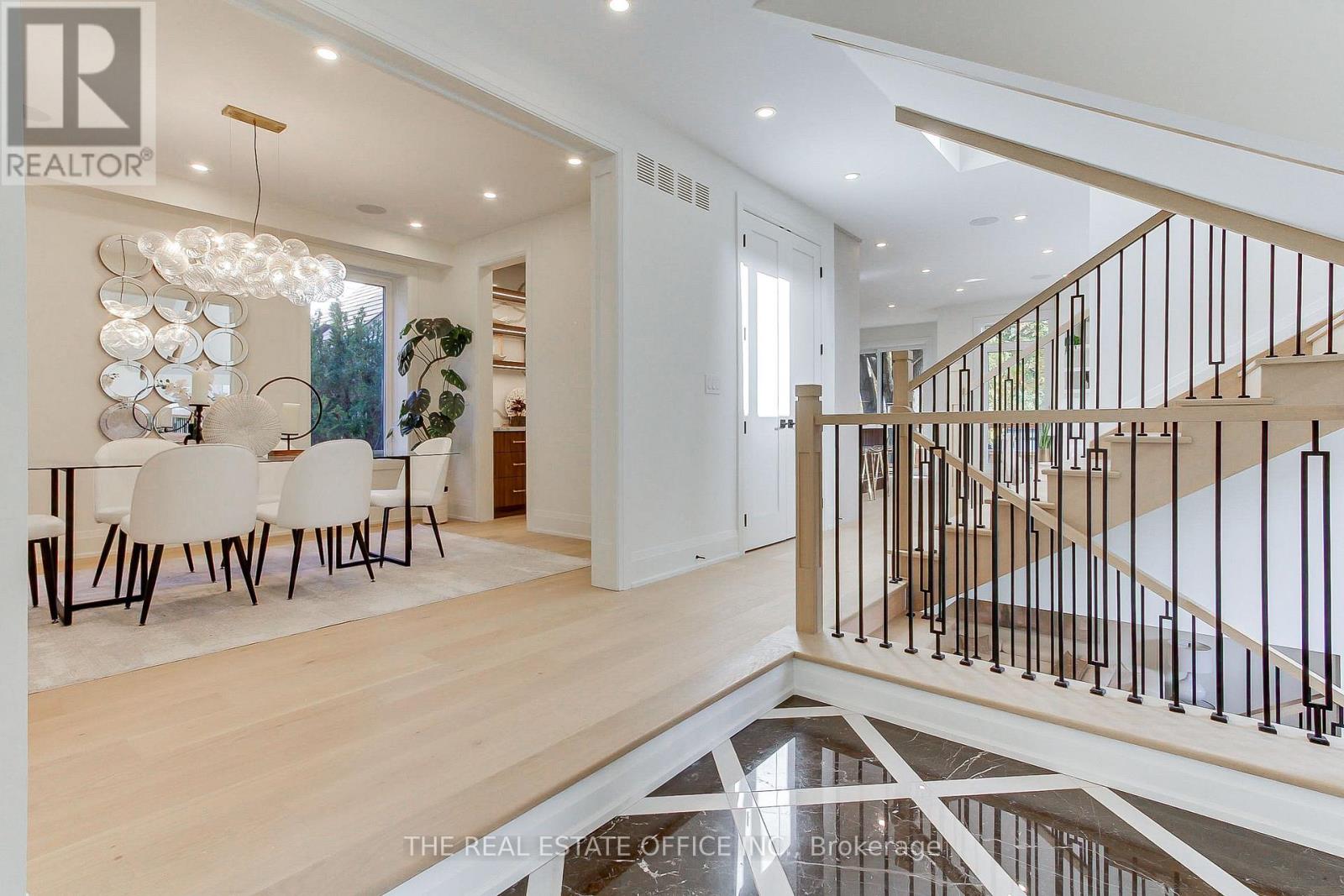 Where Modern Elegance Meets Prestigious Princess-Rosethorn Living.   Step into a residence designed for those who value space, sophistication, and refined living.  .This custom-built masterpiece offers approximately 2,953 sq. ft. above grade, thoughtfully designed to blend comfort with grandeur. Arrive home to your private drive with 6-car parking, including a 2-car garage with soaring ceilings, and step inside to a sunlit open-concept interior where marble floors, engineered hardwood, and expansive windows create a seamless indoor-outdoor connection.The main level flows effortlessly, anchored by a chef-inspired kitchen - ideal for elegant entertaining or refined everyday living. Natural light pours into every corner, highlighting both the craftsmanship and the home's modern design.Upstairs, discover four spacious bedrooms, each offering comfort and privacy, complemented by spa-inspired ensuite bathrooms that redefine at-home relaxation.The fully finished basement is a standout feature: 8-9 ft ceilings, sun-filled open-concept entertainment space, a guest bedroom, and a 3-piece bath create a versatile retreat for guests, media, or lifestyle gatherings. A wet bar rough-in provides the perfect foundation for hosting elevated gatherings or creating a private lounge area, making this space both functional and luxurious.Premium features throughout elevate daily life:Integrated camera security systemBuilt-in surround speakersCentral vacuumIn-ground sprinkler systemLocation delivers lifestyle: steps from top-rated schools, scenic parks, golf clubs, boutique shopping, and public transit, with effortless access to Highways 401 & 427 and Pearson International Airport.This isn't just a house - it's a statement address, a private sanctuary, and a setting for the next chapter of your life.Turnkey. Rare. Distinctive. (id:48254)