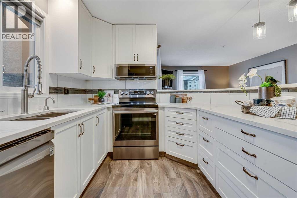 8128, 304 Mackenzie Way Sw, Airdrie, Alberta  T4B 3H8 - Photo 2 - A2274092