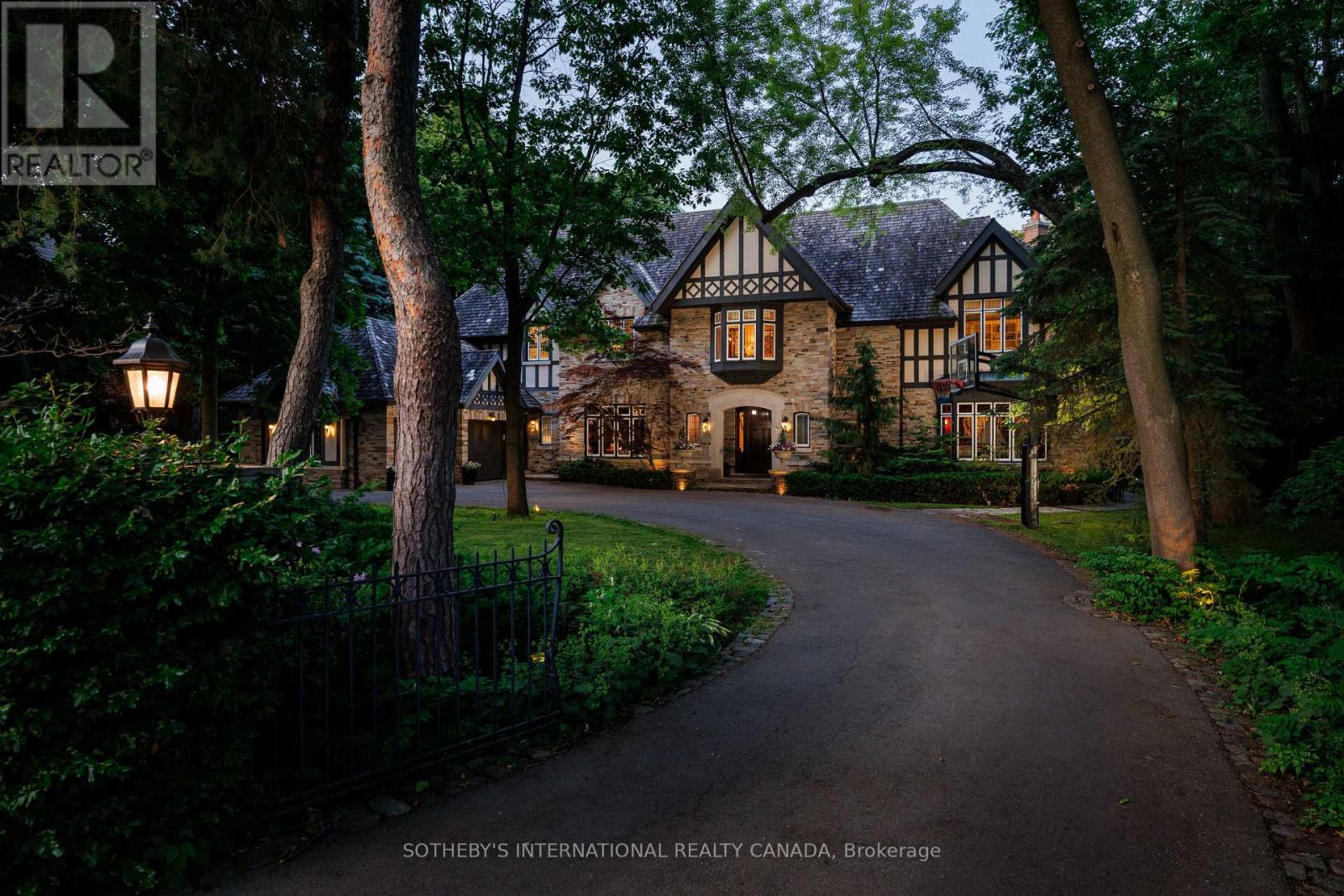 Welcome to a truly exceptional estate tucked away in one of the Kingsway's most coveted, family-friendly enclaves. Perfectly positioned on a breathtaking ravine lot, this majestic custom-built Tudor-style home offers the ultimate in luxury, privacy, and natural beauty. Enjoy a resort-inspired backyard oasis complete with a stunning pool, lush landscaping, and endless space to entertain.Inside, the beautifully renovated chef's kitchen is the heart of the home - thoughtfully designed for both everyday living and large gatherings. Expansive windows throughout invite spectacular ravine views into nearly every room, filling the home with natural light. With approximately 10,000 sq ft of luxurious living space, this remarkable residence offers 7+2 spacious bedrooms, including an opulent primary suite with a private sitting area, custom dressing room, and spa-like ensuite. Heated floors in the bathrooms add another layer of comfort.This is a rare opportunity to live in a quiet, prestigious pocket that offers incredible convenience.Walk to top-rated schools like Our Lady of Sorrows (OLS) and Lambton Kingsway Junior Middle School (LKS), stroll to nearby parks, shops, and the subway, and enjoy effortless access to downtown and major highways.This is more than a home it's a lifestyle. (id:48254)