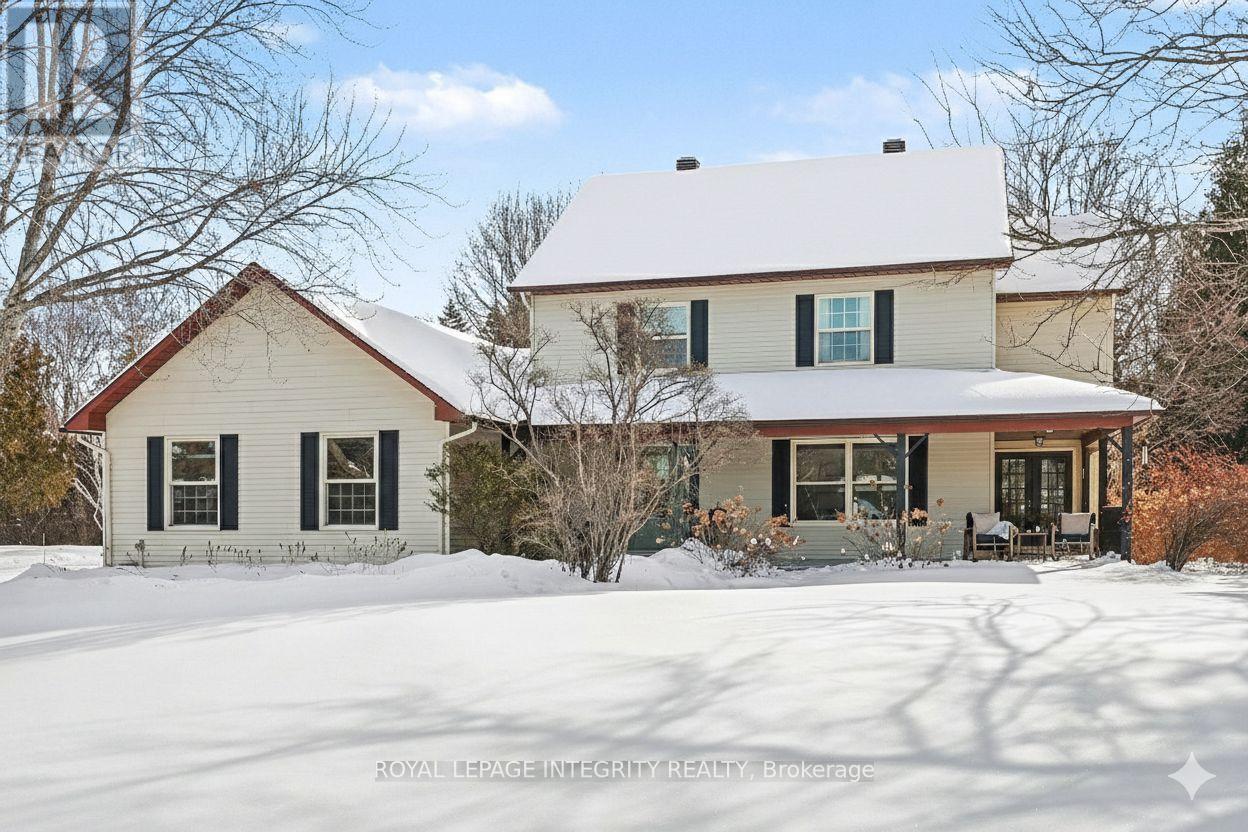 Tucked away on a quiet cul-de-sac in the heart of Manotick Estates, lies a very special family home set among mature trees, manicured hedges int he most established neighbourhoods in the area. Step outside your door, you're instantly connected to the scenic trail network that winds through the community, leading you to beautiful parks & Manotick's charming Main Street - home to much loved coffee shops, great restaurants & local boutiques. Designed with family life in mind, the layout is both classic & incredibly functional. The main floor offers a formal living room that flows directly into a formal dining room - perfect for hosting holidays & special gatherings. The updated kitchen has amazing storage & generous counter space, making everyday cooking & entertaining a pleasure. The eat-in kitchen area is where life really happens, overlooking the private, oversized backyard The sunken family room is a perfect place to unwind beside the cozy wood-burning fireplace. A convenient powder room & laundry located off the side entry complete the floor. Upstairs, 4 spacious bedrooms, along with a beautifully renovated main bathroom. The primary suite is a true retreat, featuring two walk-in closets & a gorgeous ensuite that feels straight out of a magazine - complete with a free-floating tub, double vanity & an amazing glass-encased walk-in shower. The third floor adds incredible flexibility, offering endless possibilities as a guest space, home office, movie room, kids' hangout, birthday party hub or sleepover central. Lovingly maintained and thoughtfully updated, this move-in-ready home strikes the perfect balance between timeless character and everyday comfort. Enjoy quiet mornings with coffee on the wraparound porch, apple picking in the fall, & warm summer nights under the stars in your expansive backyard. Offers to be presented at 2PM, Tuesday February 3rd 2026. (id:48254)