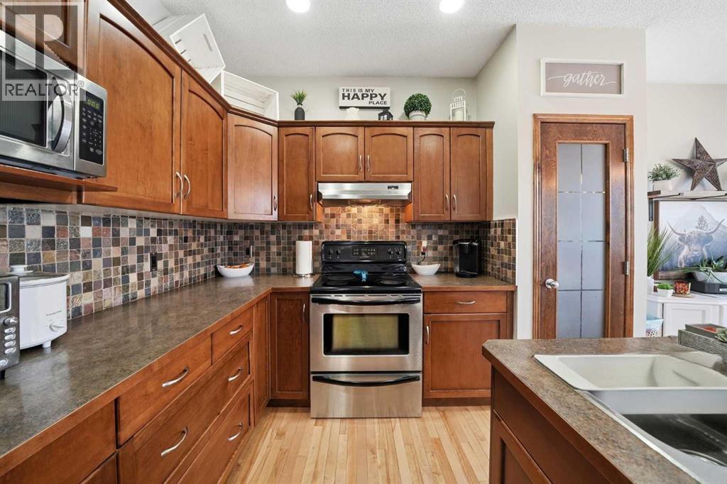 155 Cimarron Grove Circle, Okotoks, Alberta  T1S 2M1 - Photo 9 - A2274025