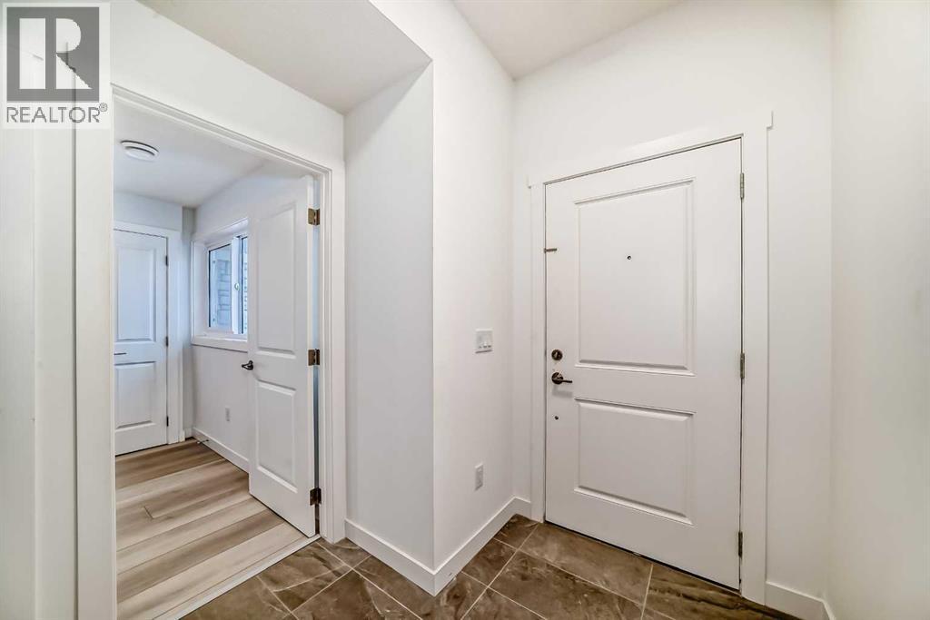 205, 33 Merganser Drive W, Chestermere, Alberta  T1X 2S2 - Photo 3 - A2281064