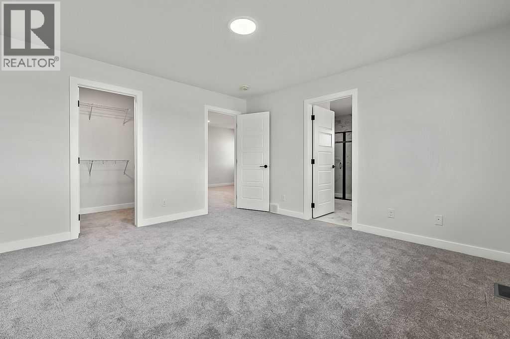 71 Southborough Crescent, Cochrane, Alberta  T4C 3J3 - Photo 17 - A2273098