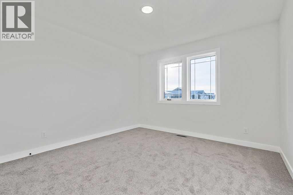 71 Southborough Crescent, Cochrane, Alberta  T4C 3J3 - Photo 23 - A2273098