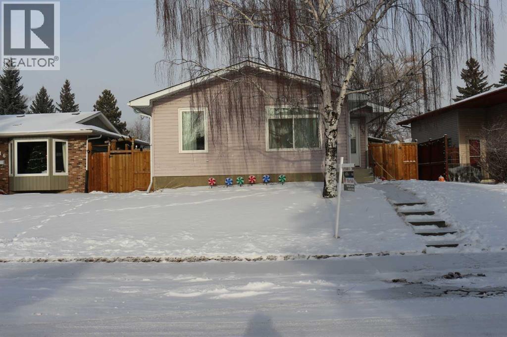 112 Woodvale Road Sw, Calgary, Alberta  T2W 3M8 - Photo 1 - A2275374
