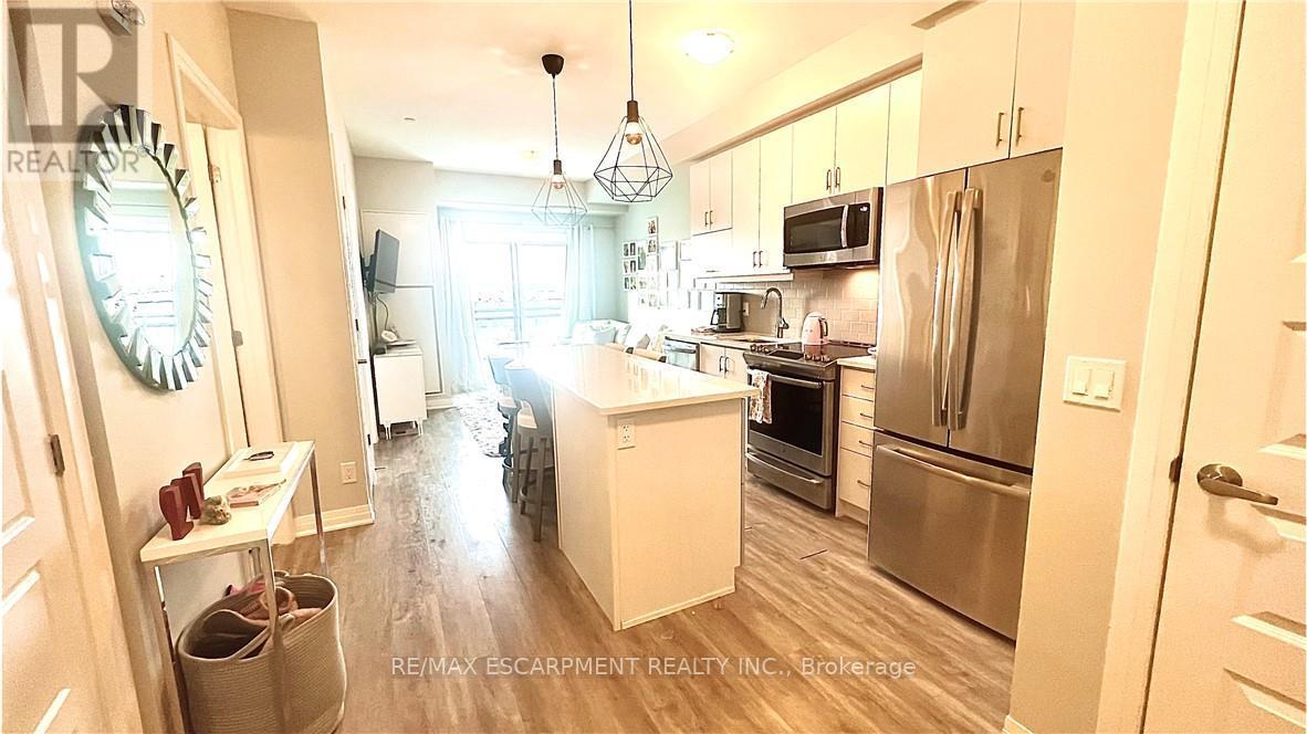 408 - 128 Grovewood Common, Oakville, Ontario  L6H 0X3 - Photo 3 - W12743222