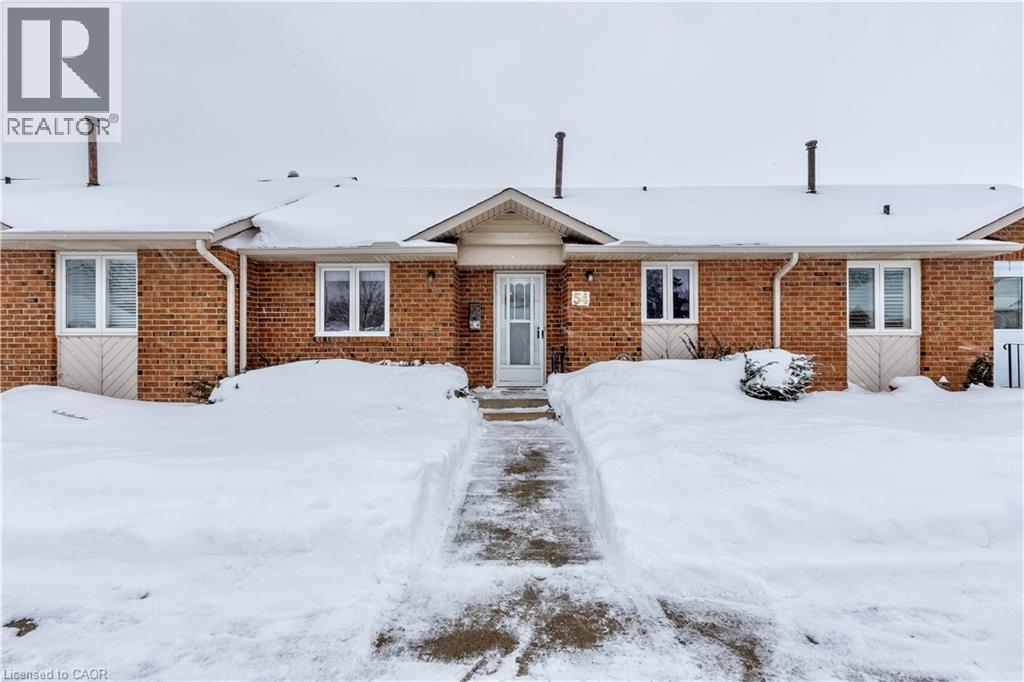 Located in central St. Catharines, this solidly built two plus one bedroom, two bathroom townhouse condominium offers convenient main floor living in a quiet, mostly adult community. Ideal for first time buyers and those looking to downsize or enjoy low maintenance living, the main floor features a spacious eat in kitchen with ample cupboard and counter space, a dining area with patio doors leading to a private outdoor space perfect for morning coffee, relaxing, or barbecuing, along with a comfortable living room and main floor laundry. Spacious bathrooms and thoughtful storage add to the home's practicality. The fully finished basement includes a large rec room with high ceilings, a bonus bedroom or office space, a workshop ideal for the handy person, a second bathroom, and a dedicated storage room. While some updating is needed, the home is solidly built and offers excellent potential in a well maintained community close to shopping, parks, quick QEW access, and walkable amenities. Additional parking for a second vehicle may be available at an extra cost. (id:48254)