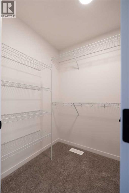 143 Wolf Hollow Rise Se, Calgary, Alberta  T2X 4M8 - Photo 29 - A2269119