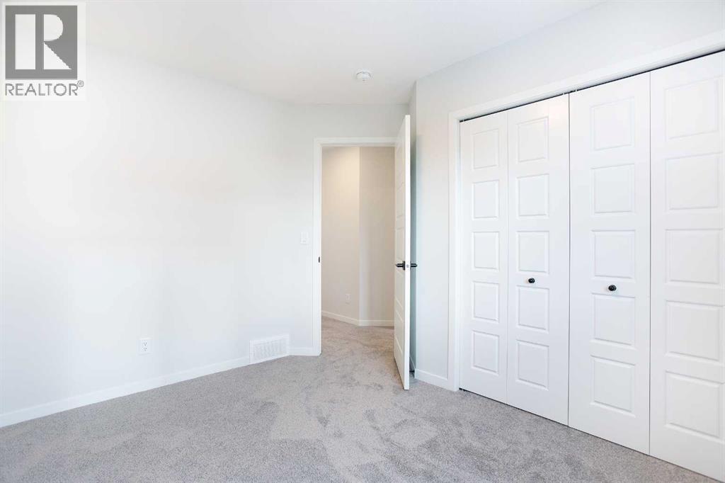 49 Creekside Passage Sw, Calgary, Alberta  T2X 5V6 - Photo 16 - A2279243