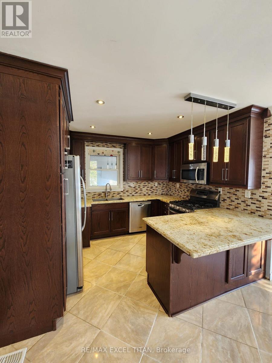 12 Wickford Drive, Toronto, Ontario  M6L 1K7 - Photo 9 - W12750624