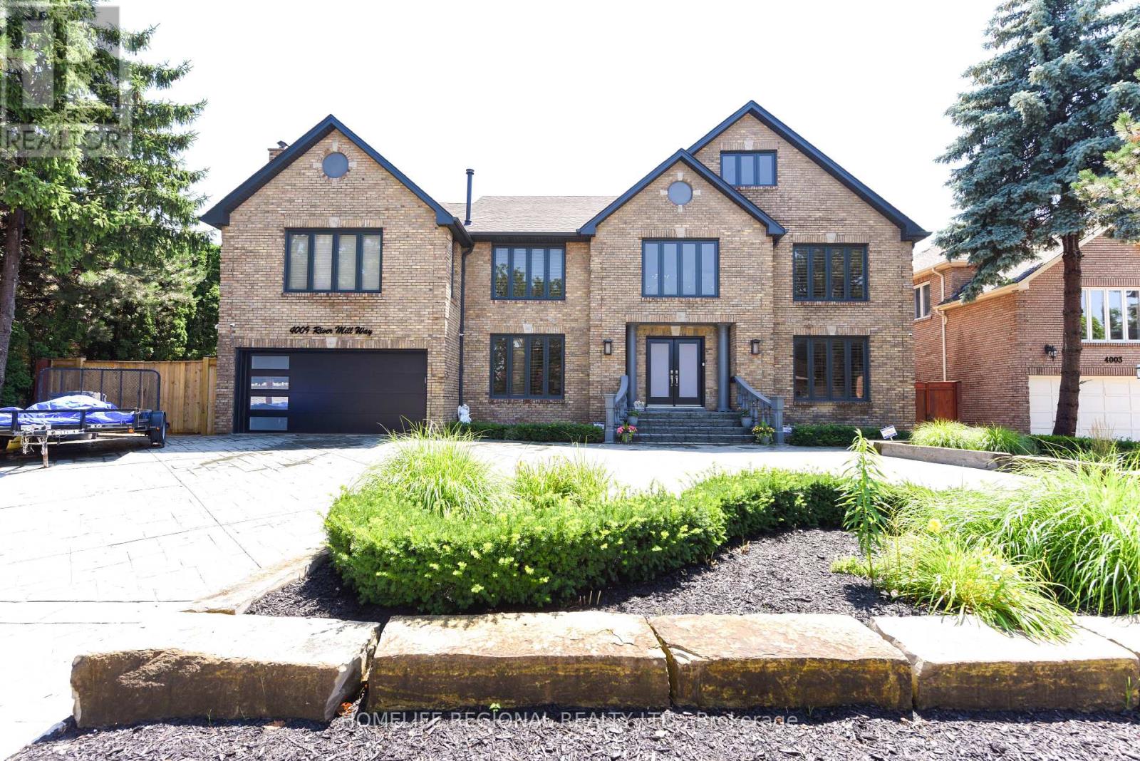 Welcome to this exceptionally stunning home nestled in the sought-after Rathwood Community, offering an impressive approximately 4,691 sq. ft. of luxurious living space as per MPAC. Boasting 13+2 spacious rooms, including 6+2 bedrooms and 6 well-appointed washrooms. This home is thoughtfully designed to meet the needs of a large or multi-generational family. Step inside to discover an awe-inspiring living room with 18-foot ceilings, a cozy gas fireplace, and a walkout to the deck perfect for entertaining or relaxing in style. The modern kitchen overlooks the beautifully landscaped backyard and features large windows that flood the space with natural light, plus another walkout for seamless indoor-outdoor living. The family room, located above the garage, adds even more space and warmth with its own gas fireplace. The home also features a fully separate in-law suite in the basement, ideal for extended family or rental potential. Outside, enjoy the convenience of a circular patterned concrete driveway, a double car garage with direct home access, and parking for 8+ vehicles. The professionally landscaped yards showcase armor stone accents, creating a private and serene setting. Additional highlights include two brand-new skylights (2024), high-quality finishes throughout, and a quiet, residential street setting. Located just minutes from major highways (427, 401, 403), public transit, Sherway Gardens, Square One, Costco, and more. Backing directly onto Garnetwood Park, enjoy walking trails, tennis and basketball courts, a baseball diamond, playground, and a leash-free dog area right in your own backyard. (id:48254)